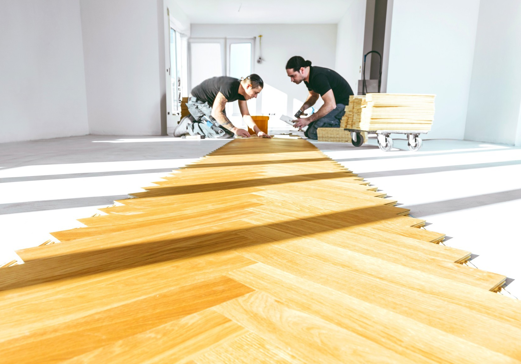 2 Fitters Installing a Herrginbone Floor Sunny Bright